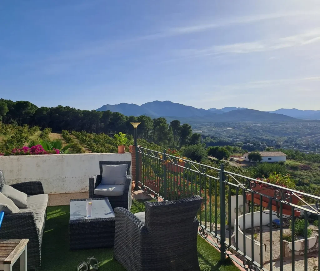 Terrace with lounge chairs looking out over the Guadalhorce valley and the mountains