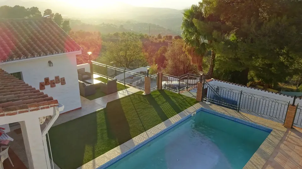 Afternoon sun over the pool, the white casita and the valley